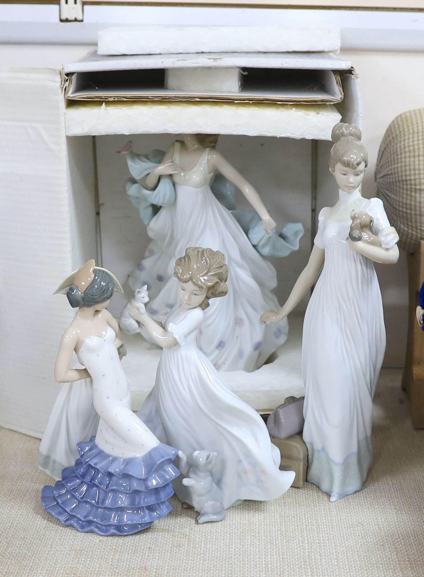 A selection of Lladro and Nao figures